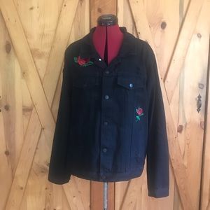 Distressed denim jacket with rose embellishments
